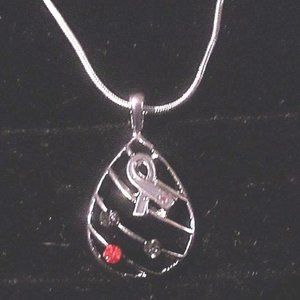 Gems on lattice drop with gray-ribbon charm